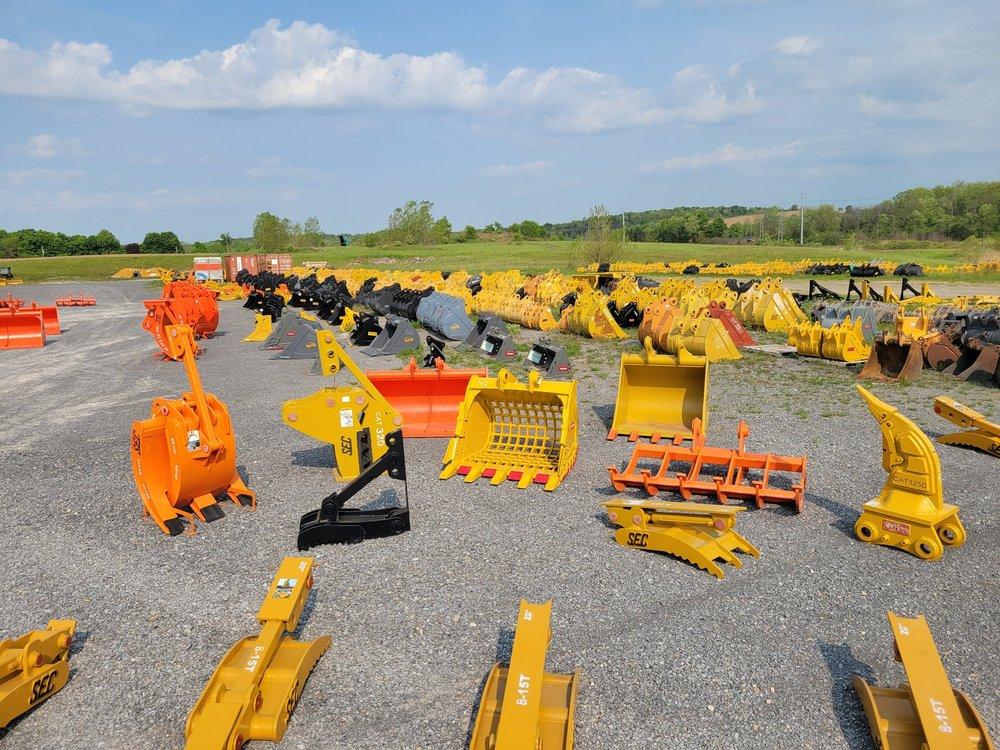 Excavator attachments displayed for sale and rental to help contractors choose the best equipment option.