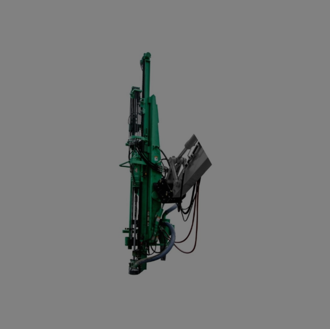Side view of a Montabert CPA drilling rig in its distinctive green color, equipped with advanced hydraulic systems and mechanisms for efficient drilling operations.
